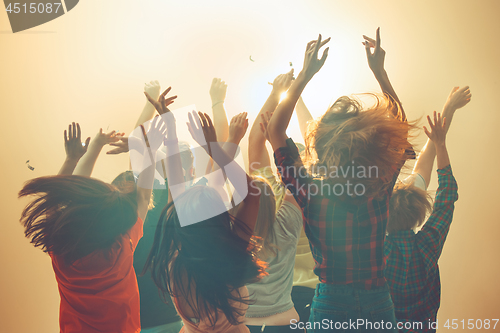 Image of Nightlife and disco concept. Young people are dancing in club.