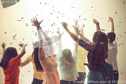 Image of Nightlife and disco concept. Young people are dancing in club.