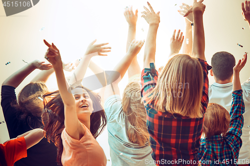 Image of Nightlife and disco concept. Young people are dancing in club.