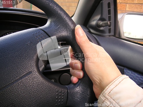 Image of holding a steering wheel