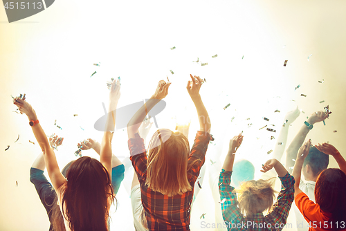 Image of Nightlife and disco concept. Young people are dancing in club.