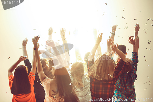 Image of Nightlife and disco concept. Young people are dancing in club.