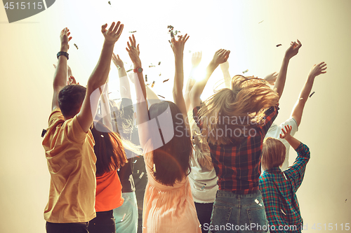 Image of Nightlife and disco concept. Young people are dancing in club.