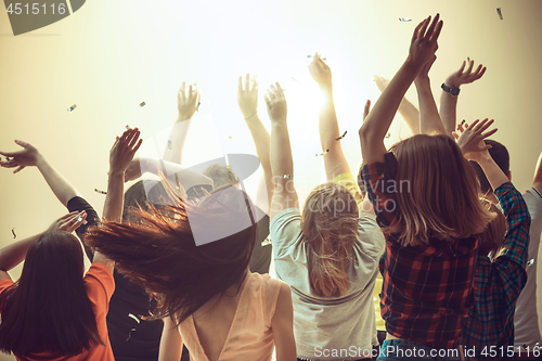 Image of Nightlife and disco concept. Young people are dancing in club.