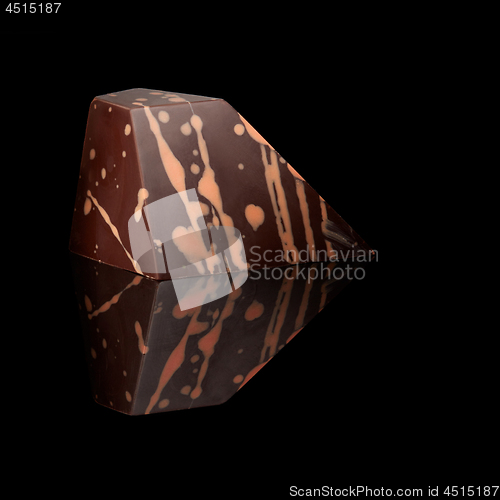 Image of chocolate candy on black background