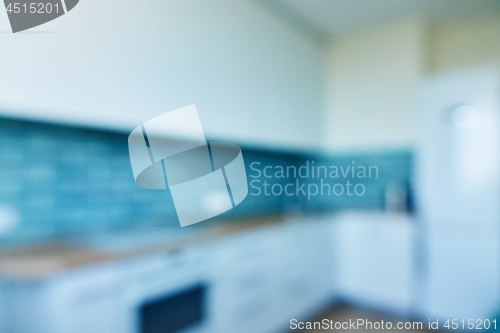 Image of Blur background, white kitchen with blue ceramic tiles