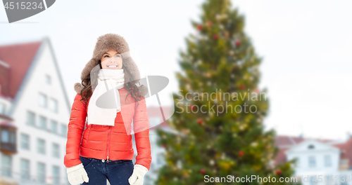 Image of happy woman over christmas tree in tallinn