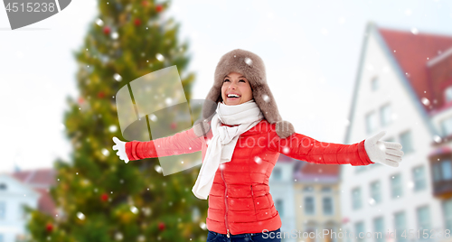 Image of happy woman over christmas tree in tallinn