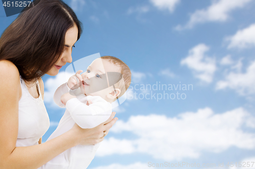 Image of mother with baby over sky background