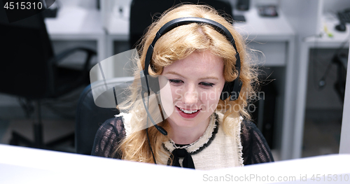 Image of female call centre operator doing her job