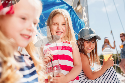 Image of The children on board of sea yacht