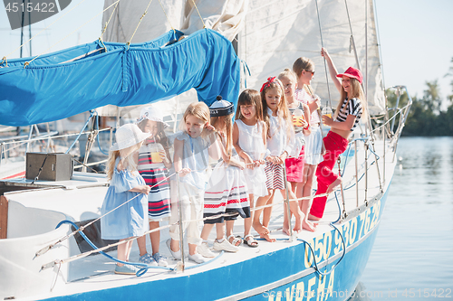 Image of The children on board of sea yacht