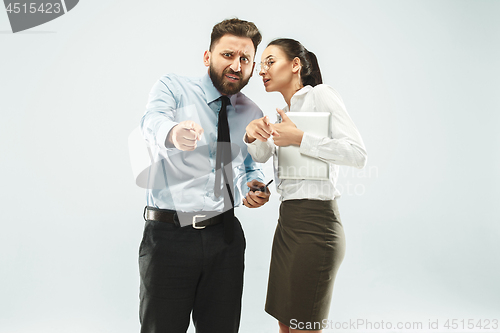 Image of a business man shows the laptop to his colleague in the office.