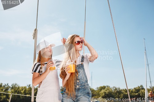 Image of The children on board of sea yacht