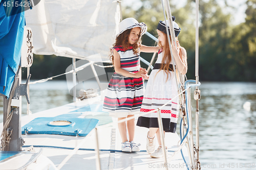 Image of The children on board of sea yacht