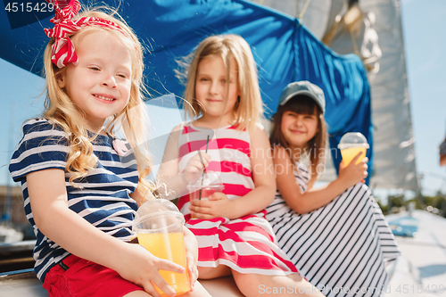 Image of The children on board of sea yacht