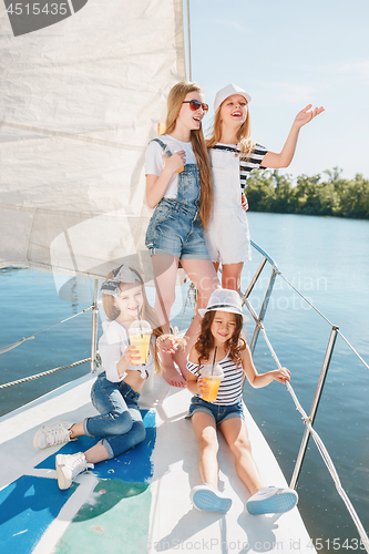 Image of The children on board of sea yacht