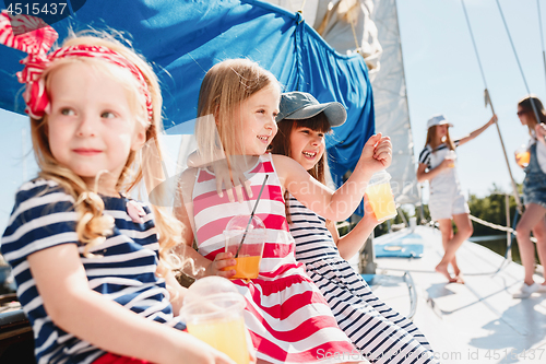 Image of The children on board of sea yacht