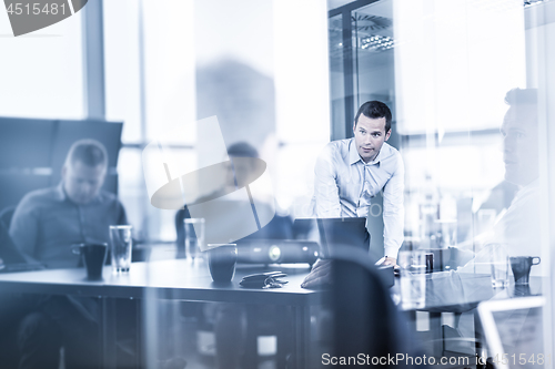 Image of Business team brainstorming on meeting in modern corporate office.