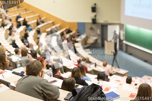 Image of Expert speaker giving a talk at scientific business conference event.