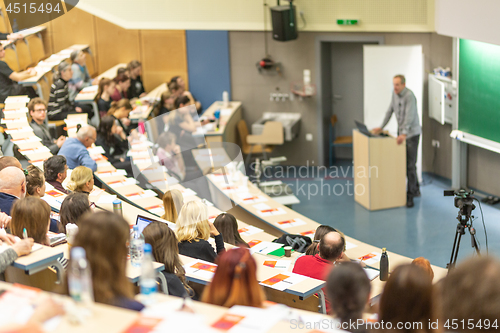 Image of Expert speaker giving a talk at scientific business conference event.