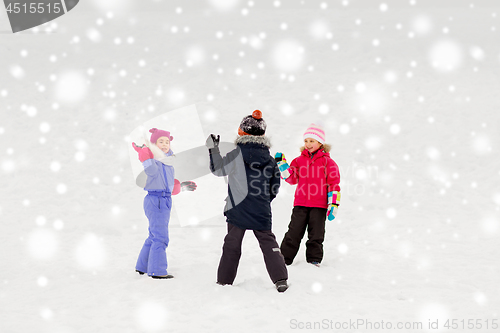 Image of happy little kids playing outdoors in winter