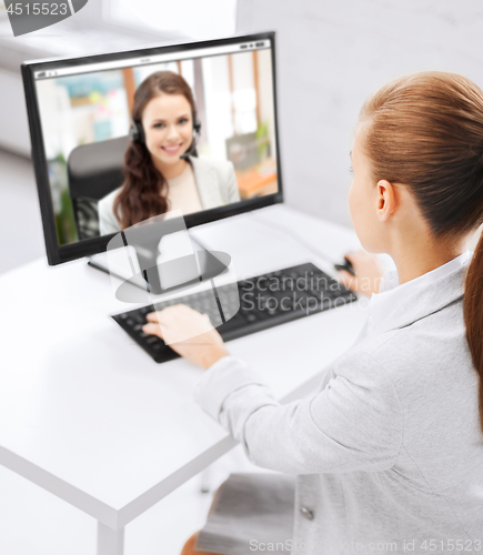 Image of businesswoman having video call on pc at office