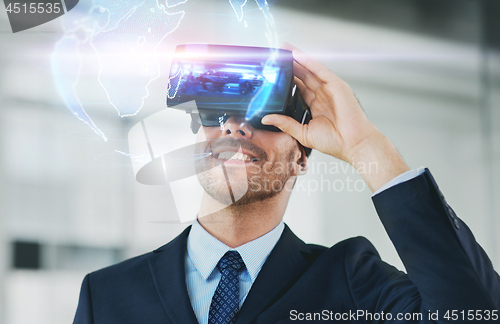 Image of businessman with virtual reality headset at office