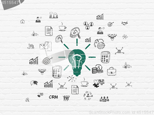 Image of Finance concept: Light Bulb on wall background