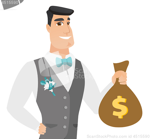 Image of Young caucasian groom showing a money bag.