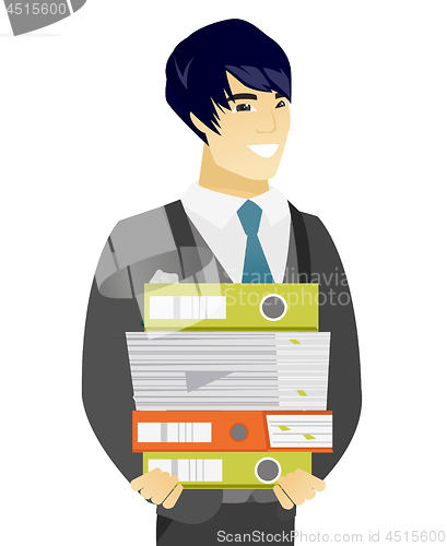 Image of Young asian groom holding pile of folders.