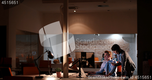 Image of young designers in the night office