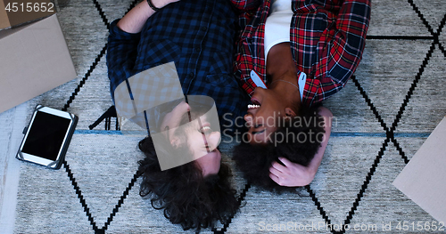 Image of Top view of attractive young multiethnic couple