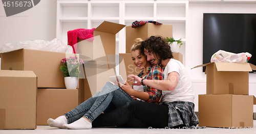 Image of young couple moving  in new house
