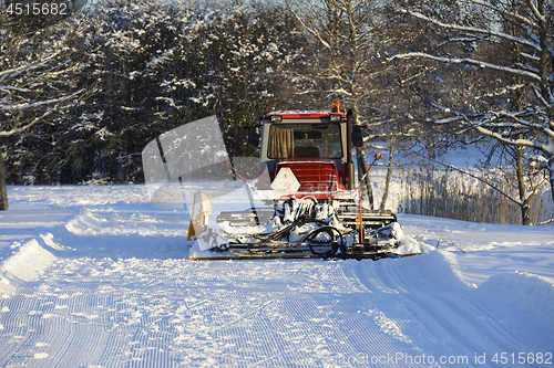 Image of ski plow in the winter in the forest