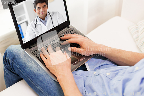 Image of patient having video chat with doctor on laptop