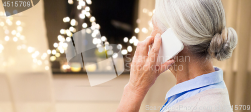 Image of close up of senior woman calling on smartphone