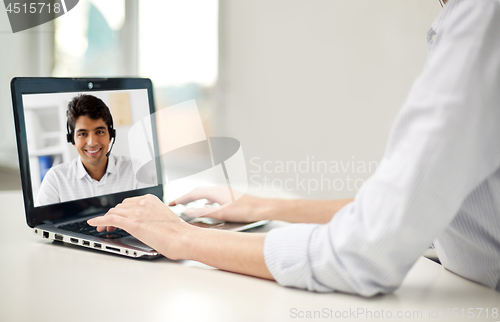 Image of businesswoman having video call on laptop