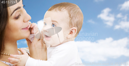 Image of mother with baby over sky background