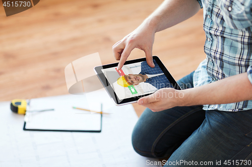 Image of man having video call with builder on tablet pc