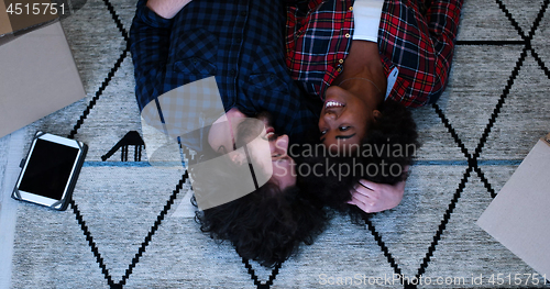 Image of Top view of attractive young multiethnic couple