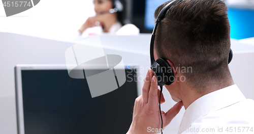 Image of male call centre operator doing his job