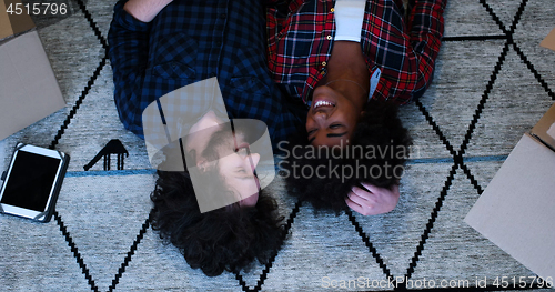 Image of Top view of attractive young multiethnic couple