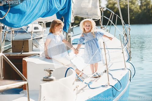 Image of The children on board of sea yacht