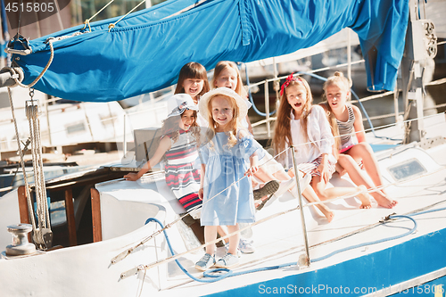 Image of The children on board of sea yacht