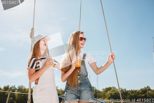 Image of The children on board of sea yacht