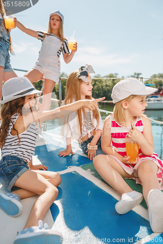 Image of The children on board of sea yacht