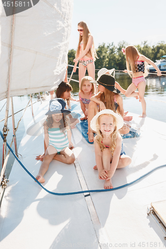 Image of The children on board of sea yacht