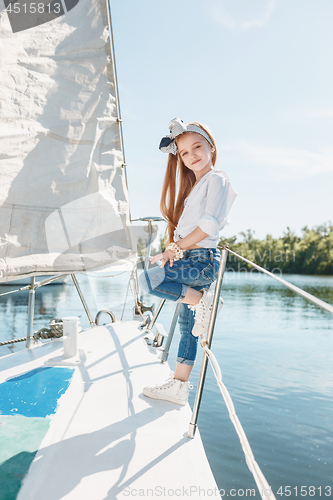 Image of The children on board of sea yacht