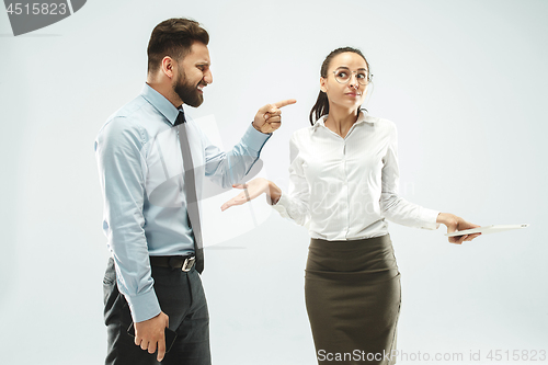 Image of a business man shows the laptop to his colleague in the office.